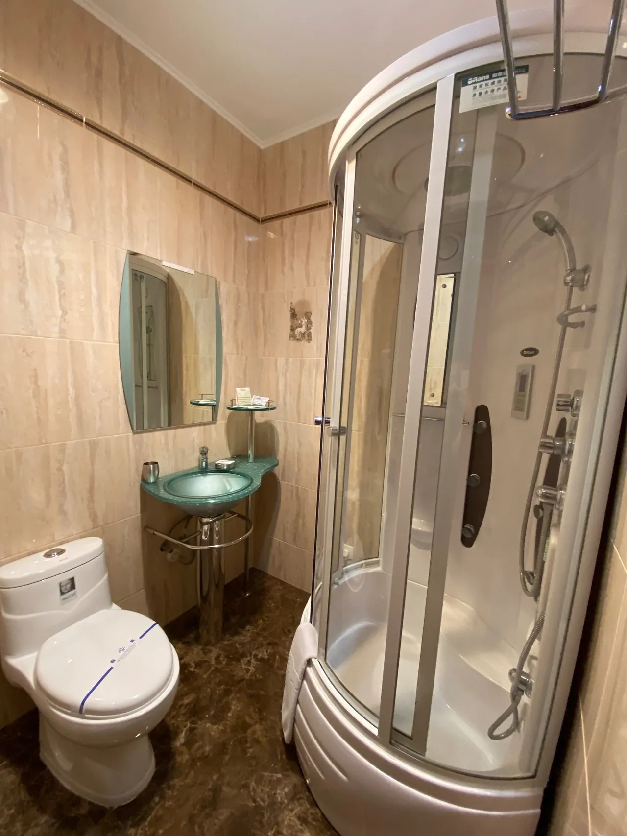 Private bathroom of the attic room with a shower cubicle
