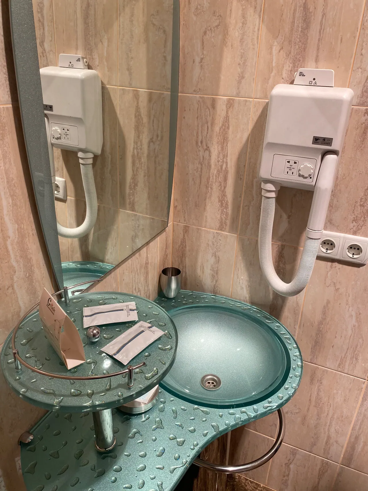 Washbasin and hairdryer in the attic room's bathroom