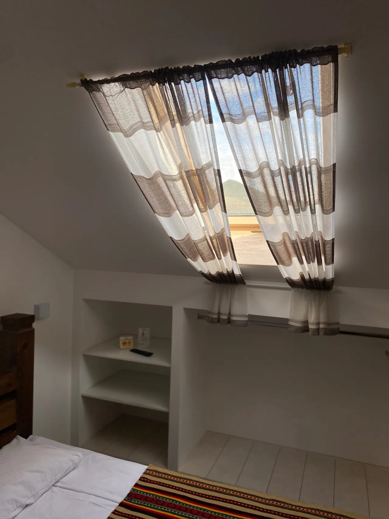 Attic window with mountain views in the air-conditioned room