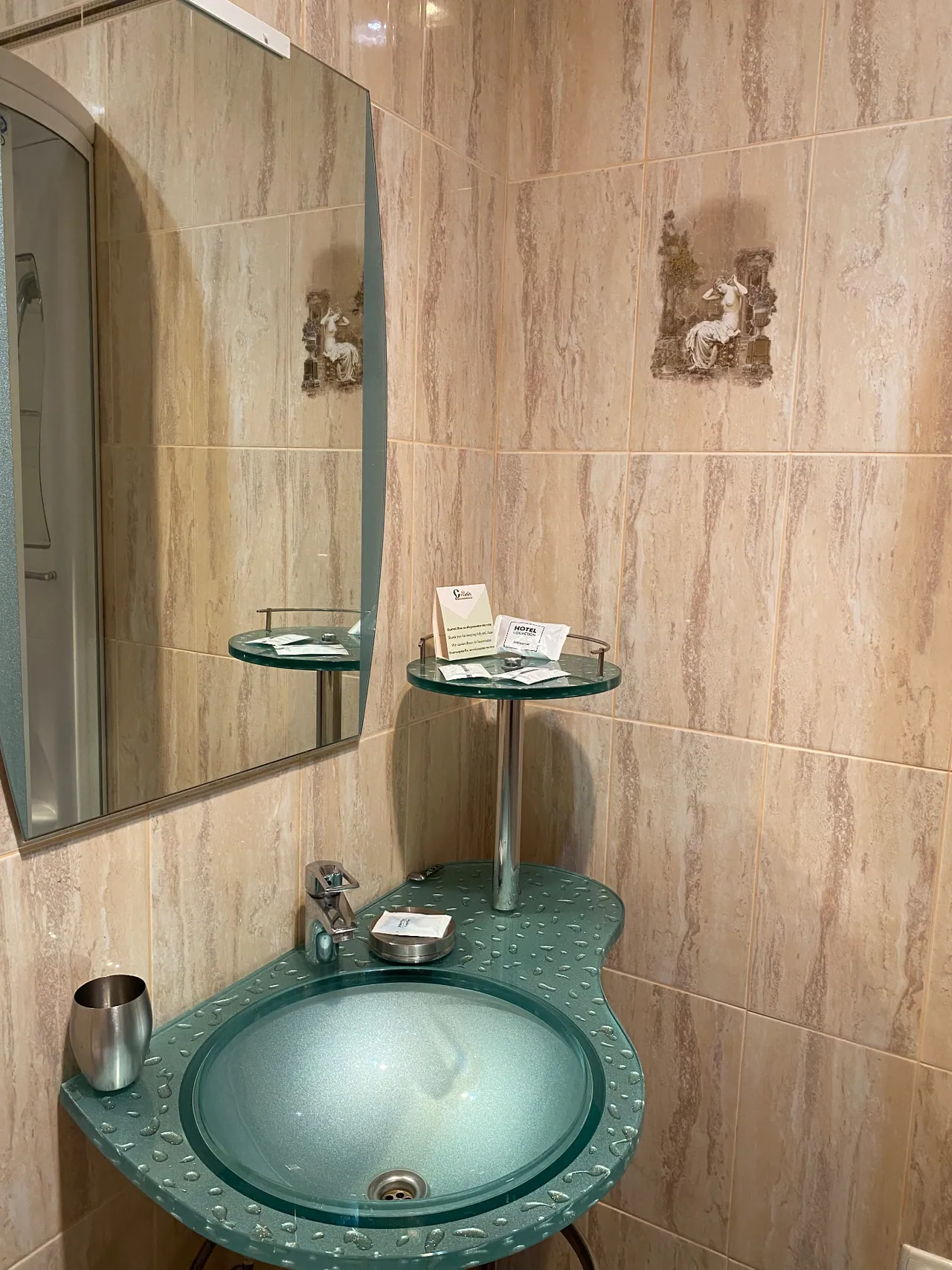 Washbasin and mirror in the attic room's bathroom
