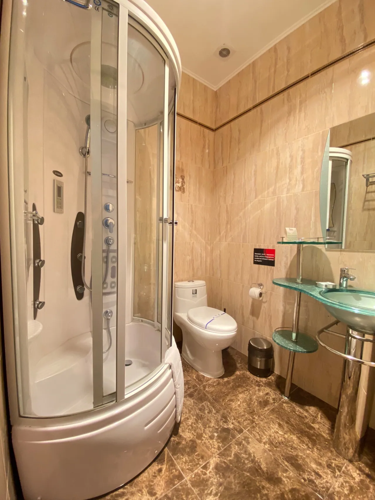 Bathroom with a shower cubicle in the attic room with two single beds