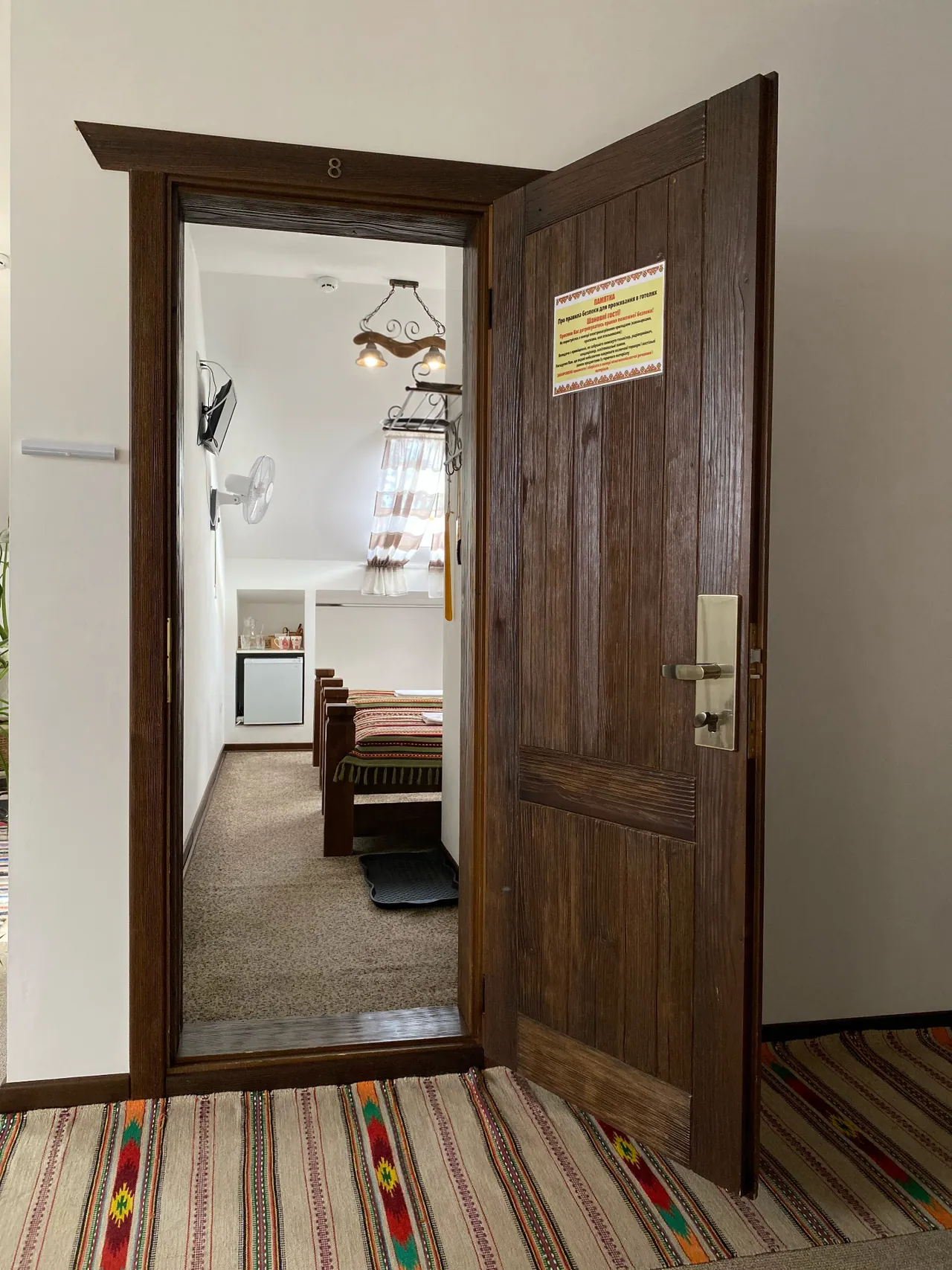 Entrance door of the attic room with a fan